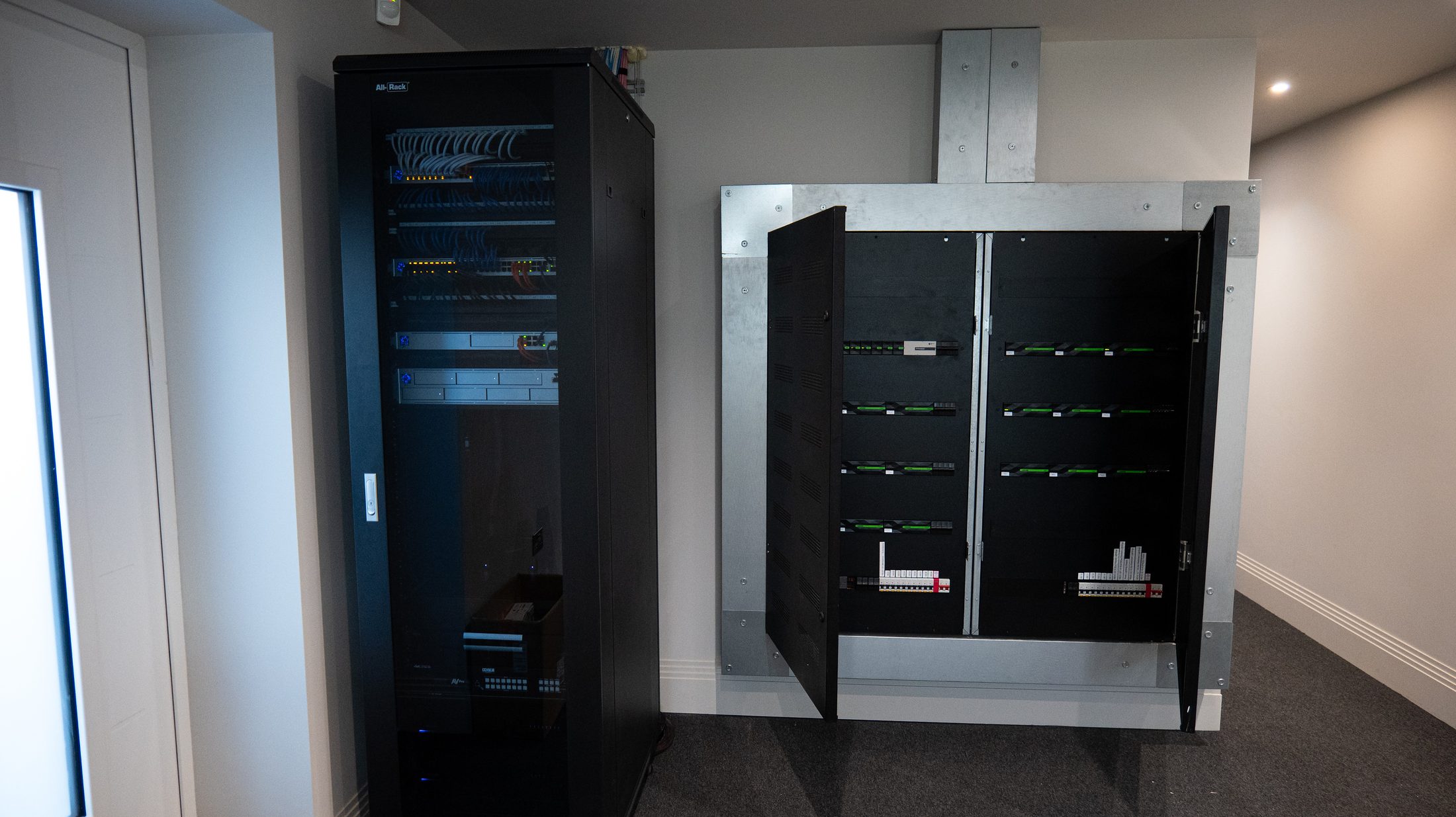 The comms rack and electrical distribution board running the whole home