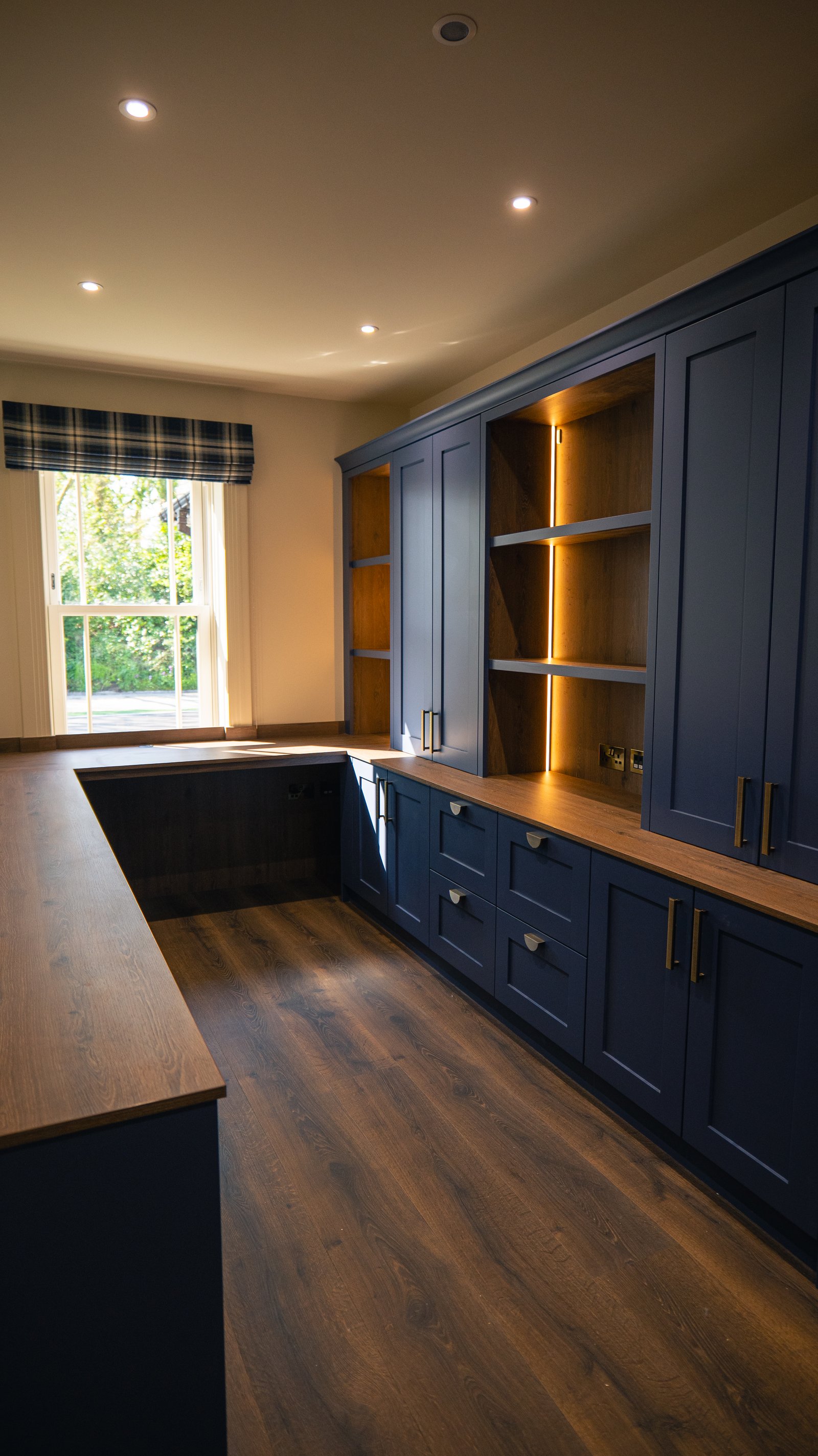 Fitted study cabinetry with concealed accent lighting